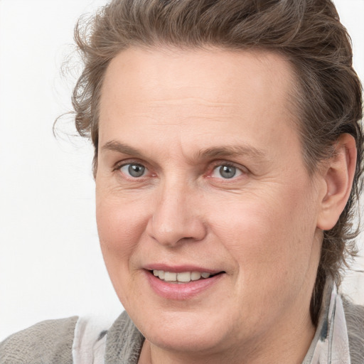 Joyful white adult male with medium  brown hair and grey eyes