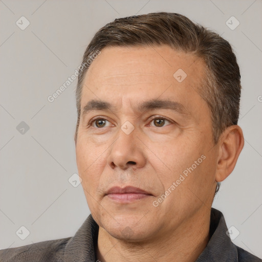 Joyful white adult male with short  brown hair and brown eyes