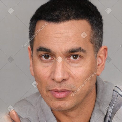 Joyful white adult male with short  black hair and brown eyes