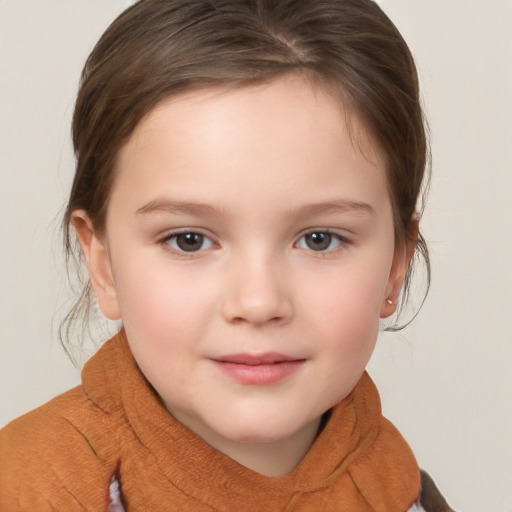 Joyful white child female with medium  brown hair and brown eyes