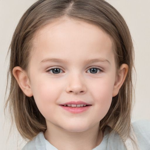 Joyful white child female with medium  brown hair and grey eyes