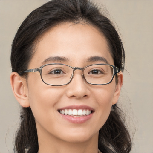 Joyful white young-adult female with medium  brown hair and brown eyes