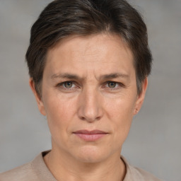 Joyful white adult female with short  brown hair and brown eyes