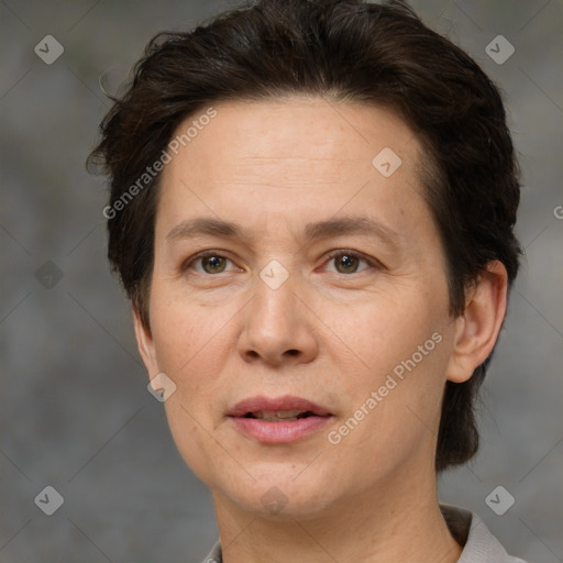 Joyful white adult female with short  brown hair and brown eyes