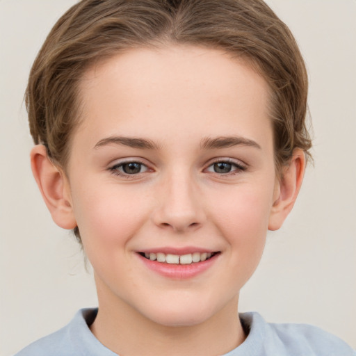 Joyful white child female with short  brown hair and grey eyes