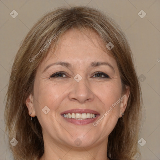 Joyful white adult female with medium  brown hair and brown eyes