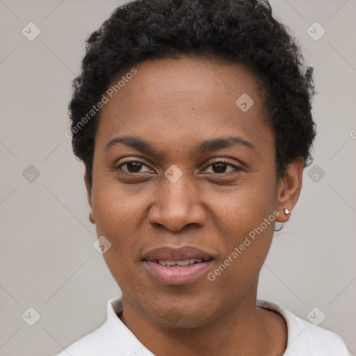 Joyful black adult female with short  black hair and brown eyes