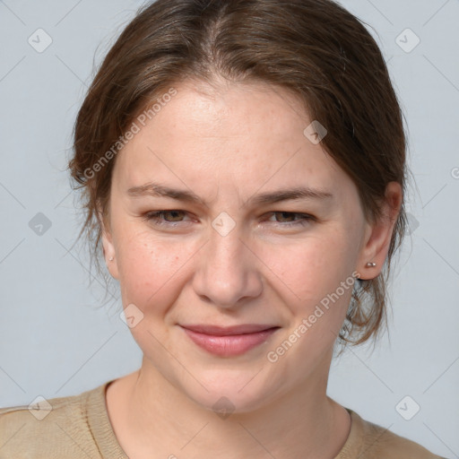 Joyful white young-adult female with medium  brown hair and grey eyes