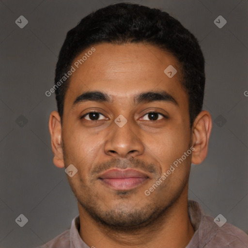 Joyful latino young-adult male with short  brown hair and brown eyes