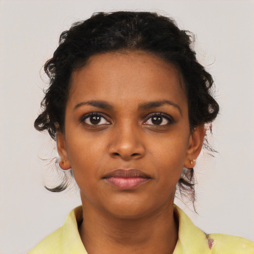 Neutral black young-adult female with short  brown hair and brown eyes