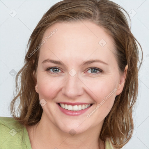 Joyful white young-adult female with medium  brown hair and blue eyes