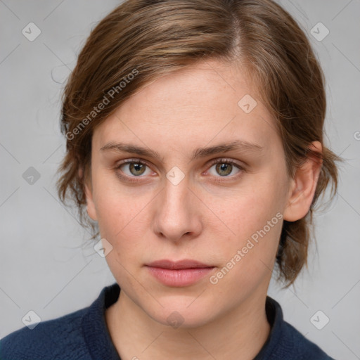 Joyful white young-adult female with medium  brown hair and blue eyes