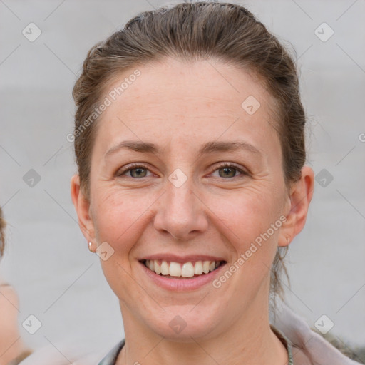 Joyful white adult female with short  brown hair and brown eyes