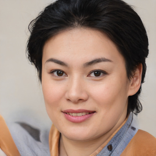 Joyful asian young-adult female with medium  brown hair and brown eyes