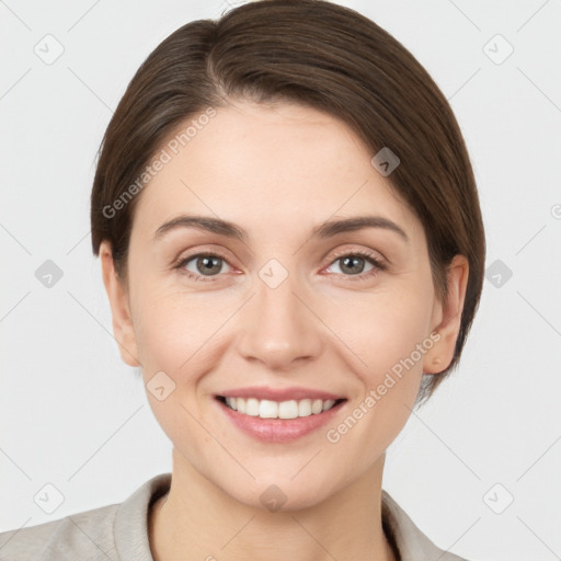 Joyful white young-adult female with short  brown hair and grey eyes