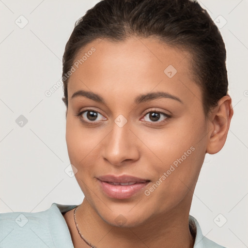 Joyful white young-adult female with short  brown hair and brown eyes