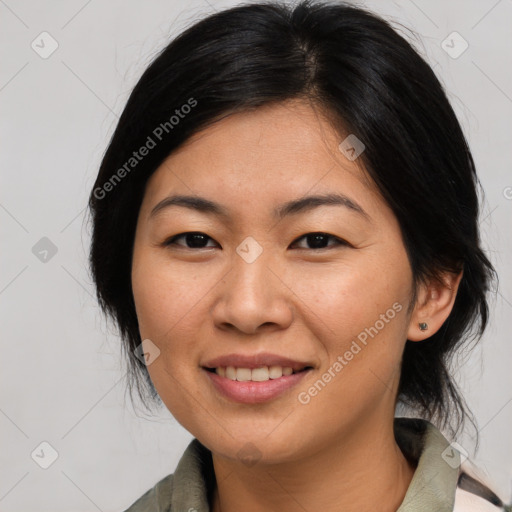 Joyful asian young-adult female with medium  black hair and brown eyes