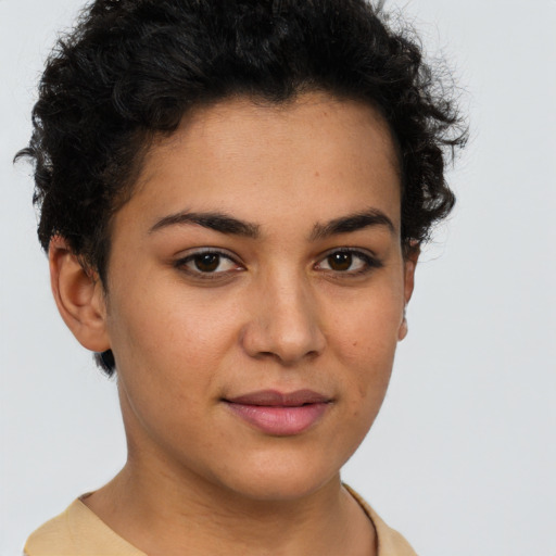 Joyful latino young-adult female with short  brown hair and brown eyes