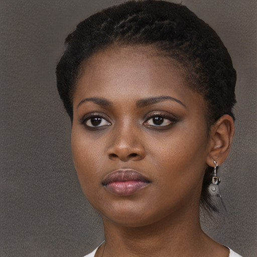 Neutral black young-adult female with long  black hair and brown eyes