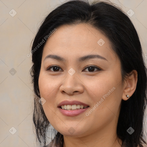 Joyful asian young-adult female with long  brown hair and brown eyes