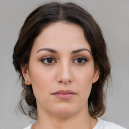 Neutral white young-adult female with medium  brown hair and brown eyes