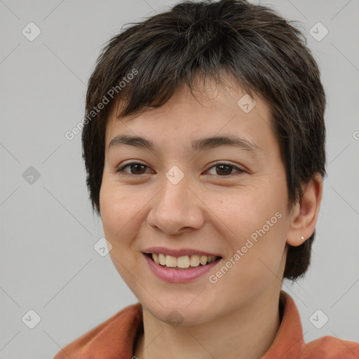 Joyful white young-adult female with short  brown hair and brown eyes