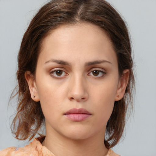 Neutral white young-adult female with medium  brown hair and brown eyes