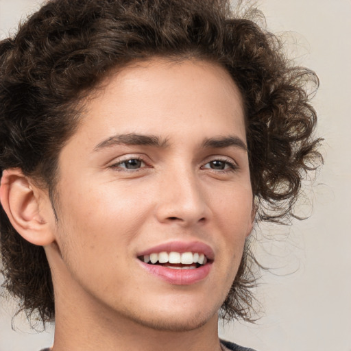 Joyful white young-adult male with medium  brown hair and brown eyes