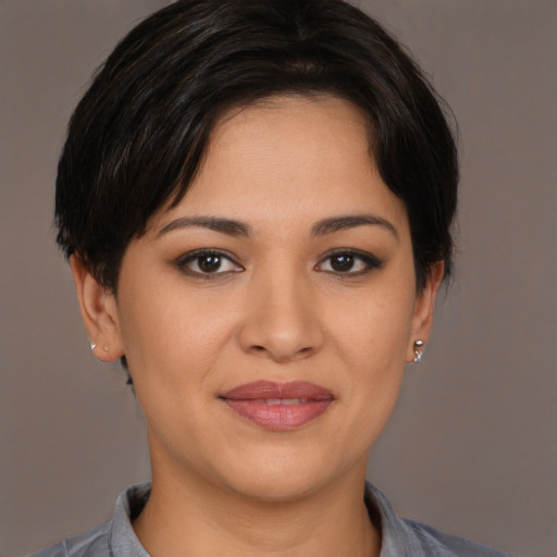 Joyful white young-adult female with short  brown hair and brown eyes