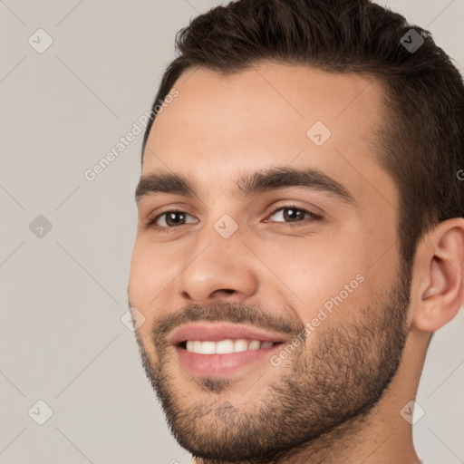 Joyful white young-adult male with short  brown hair and brown eyes