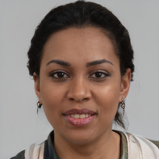Joyful latino young-adult female with medium  brown hair and brown eyes