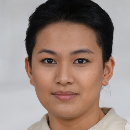 Joyful asian young-adult female with short  brown hair and brown eyes