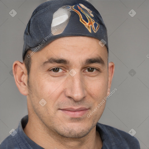 Joyful white adult male with short  brown hair and brown eyes