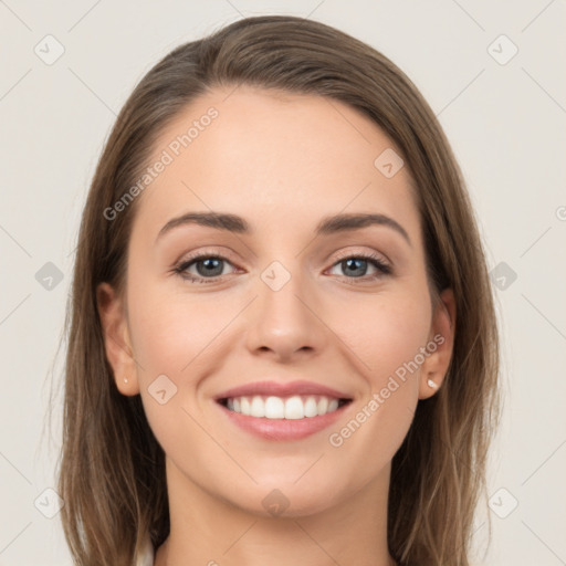 Joyful white young-adult female with long  brown hair and grey eyes