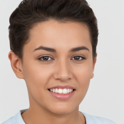 Joyful white young-adult female with short  brown hair and brown eyes