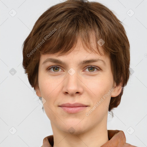 Joyful white young-adult female with short  brown hair and grey eyes