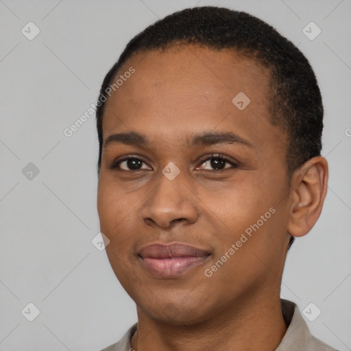 Joyful black young-adult female with short  black hair and brown eyes