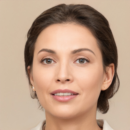 Joyful white young-adult female with medium  brown hair and brown eyes