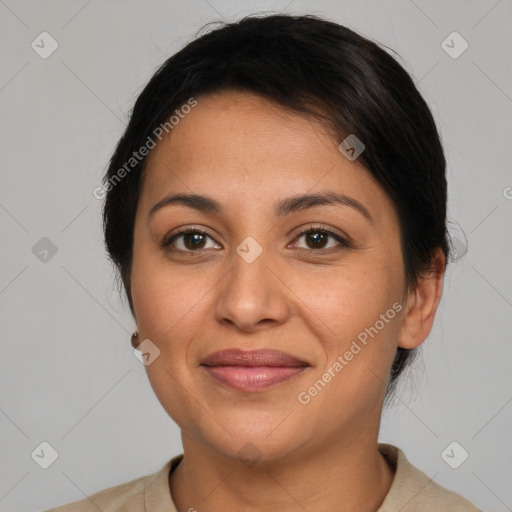 Joyful latino adult female with short  brown hair and brown eyes