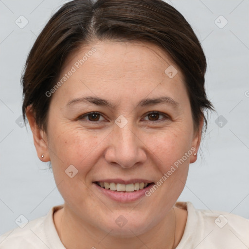 Joyful white adult female with short  brown hair and brown eyes