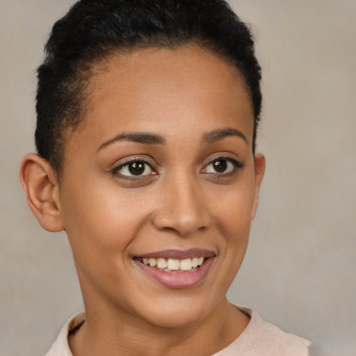 Joyful latino young-adult female with short  brown hair and brown eyes