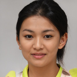 Joyful asian young-adult female with medium  brown hair and brown eyes