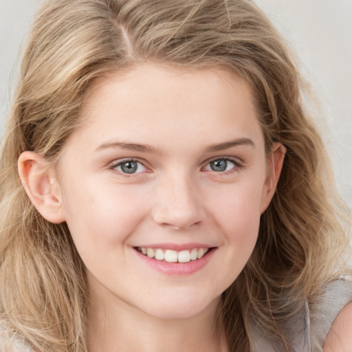 Joyful white young-adult female with long  brown hair and blue eyes