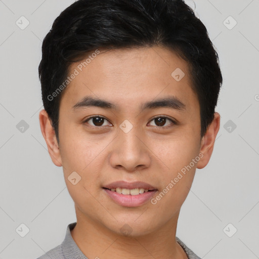 Joyful asian young-adult male with short  brown hair and brown eyes