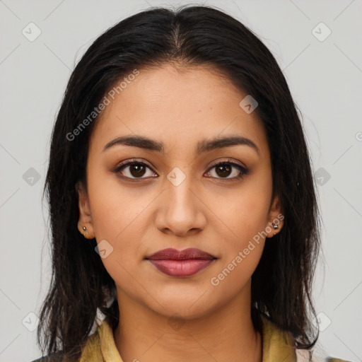 Joyful latino young-adult female with long  brown hair and brown eyes