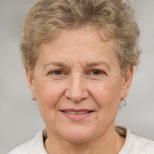 Joyful white middle-aged female with short  brown hair and brown eyes