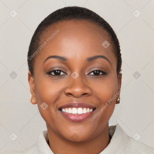 Joyful black young-adult female with short  brown hair and brown eyes