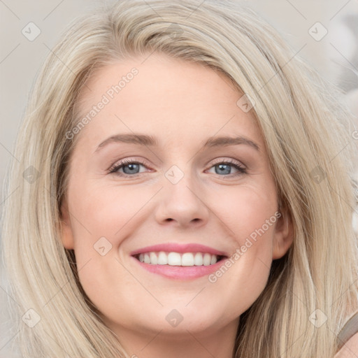 Joyful white young-adult female with long  brown hair and blue eyes