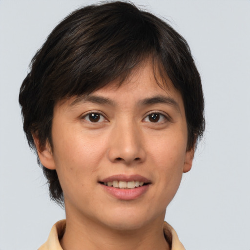 Joyful white young-adult female with medium  brown hair and brown eyes