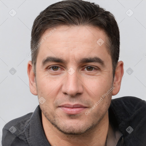 Joyful white adult male with short  brown hair and brown eyes